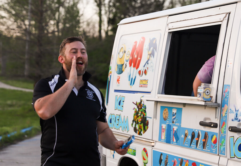 The Outlaws's team captain and club president Alex Antal calls out to his teammates while buying ice cream